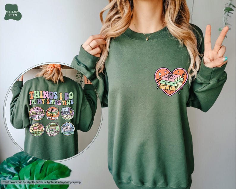 a woman wearing a green sweatshirt with a heart on it