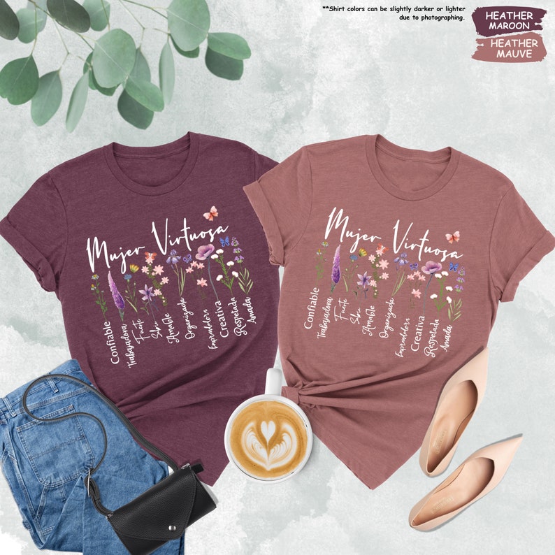 a couple of t - shirts sitting next to a cup of coffee