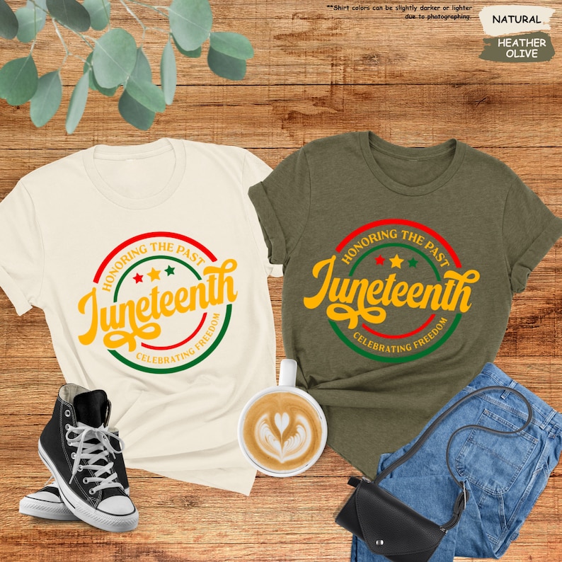 a couple of t - shirts sitting on top of a wooden floor