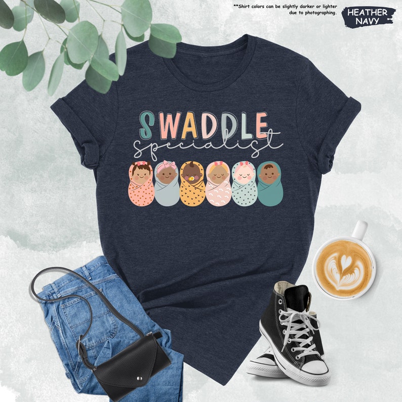 a t - shirt that says swaddle with donuts on it