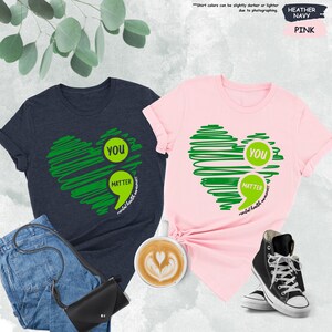 a couple of shirts that are on a table