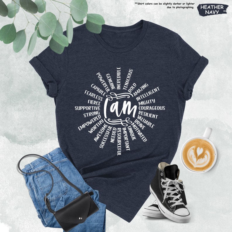 a t - shirt with the words on it next to a cup of coffee