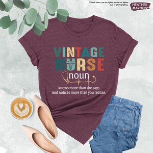 a t - shirt with the words vintage nurse on it