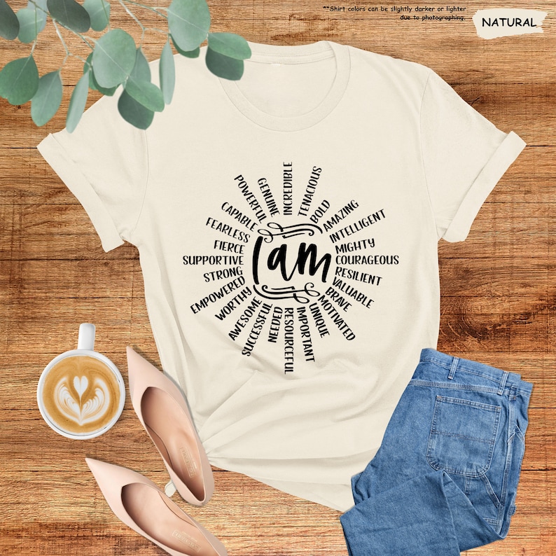 a t - shirt with the words on it next to a cup of coffee