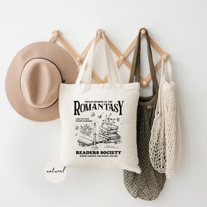 a hat and a bag hanging on a wall