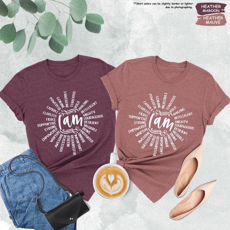 a couple of t - shirts that are next to a cup of coffee