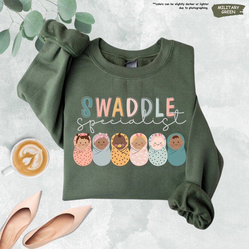 a sweater with the words swaddle spelled on it