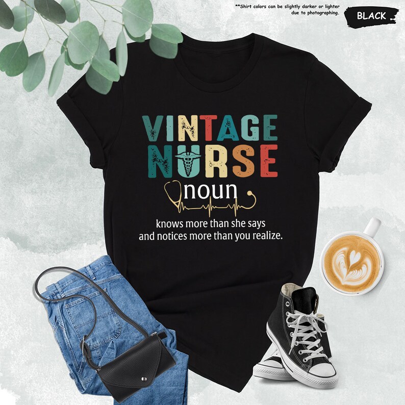 a t - shirt that says vintage nurse and a pair of jeans