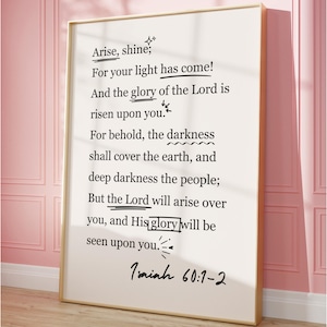 May include: A framed print with a gold border, featuring a scriptural passage from Isaiah 60:1-2 in black ink on a cream background. The text includes phrases like "Arise, shine" and "His glory will be seen upon you."