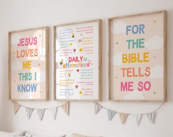 May include: Three framed wall art prints with light beige backgrounds and white clouds. The left print reads "JESUS LOVES ME THIS I KNOW". The center print features "DAILY AFFIRMATIONS" with various religious verses. The right print reads "FOR THE BIBLE TELLS ME SO".