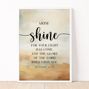 Puede incluir: Levántate y brilla, porque tu luz ha llegado y la gloria del Señor se levanta sobre ti. Isaías 60:1. Un fondo de acuarela beige y dorado con texto negro.