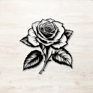 May include: Black and white rose silhouette with detailed petals and leaves. The floral design features a fully bloomed rose, stem, and several leaves. The artwork is a decorative element.