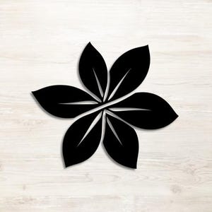 May include: A black wall art piece shaped like a five-petaled flower or a cluster of five leaves arranged in a radial pattern. Each leaf-shaped segment features a central vein line, creating a symmetrical and balanced botanical design.