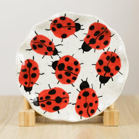 A hand-pinched ceramic ladybug dish made in Australia — the kind of tiny, characterful pottery piece that looks like it came from a boutique gallery, not a factory.