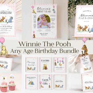 May include: A collection of Winnie the Pooh themed birthday party decorations. Includes invitations, signs, cupcake toppers, and food labels. Designs feature Pooh, Piglet, Tigger, and Eeyore with pink accents and balloons. Text includes "Olivia's First Birthday".