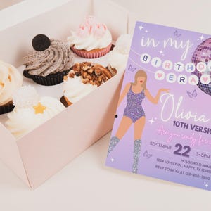 May include: A box of cupcakes with various toppings, including frosting, nuts, and an Oreo cookie. Next to the box is a lavender birthday invitation with a disco ball illustration and the text "Olivia's 10th Version."