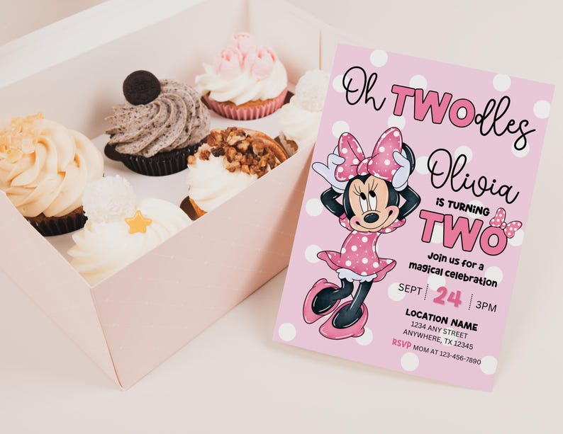 May include: A pink polka-dotted invitation with Minnie Mouse graphics and the text "Oh TWOdles Olivia is turning TWO." A box of cupcakes with various toppings sits to the left.