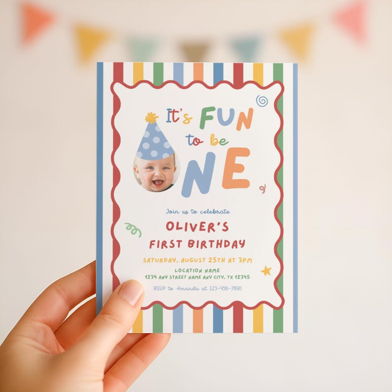 May include: A colorful birthday invitation with the text "It's FUN to be ONE." The invitation features a photo of a baby wearing a party hat. The invitation includes the text "Join us to celebrate OLIVER'S FIRST BIRTHDAY."