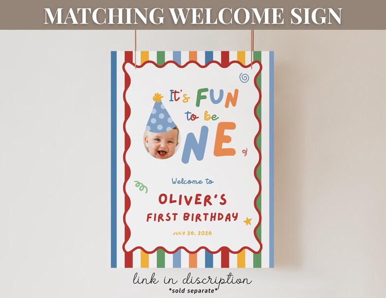 May include: A colorful birthday welcome sign with the text "It's FUN to be ONE" and a photo of a baby wearing a party hat. The sign includes the name "Oliver" and the date July 26, 2026. The sign has a red, white, and blue border.