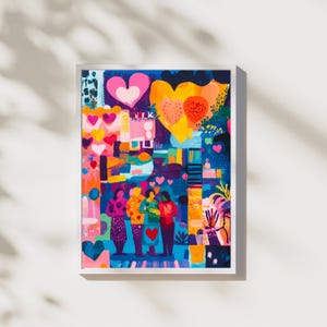 Puede incluir: Una impresión artística enmarcada con un diseño abstracto vibrante. La obra presenta un collage de corazones coloridos, figuras y formas geométricas en tonos de rosa, naranja, amarillo y azul. La impresión está montada en un marco blanco.