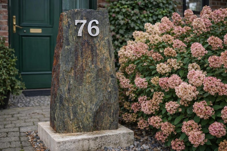 May include: A rustic wooden sign with the text "Welcome to our home" in white lettering. The sign features a distressed finish and a simple, inviting design, perfect for a front porch or entryway.