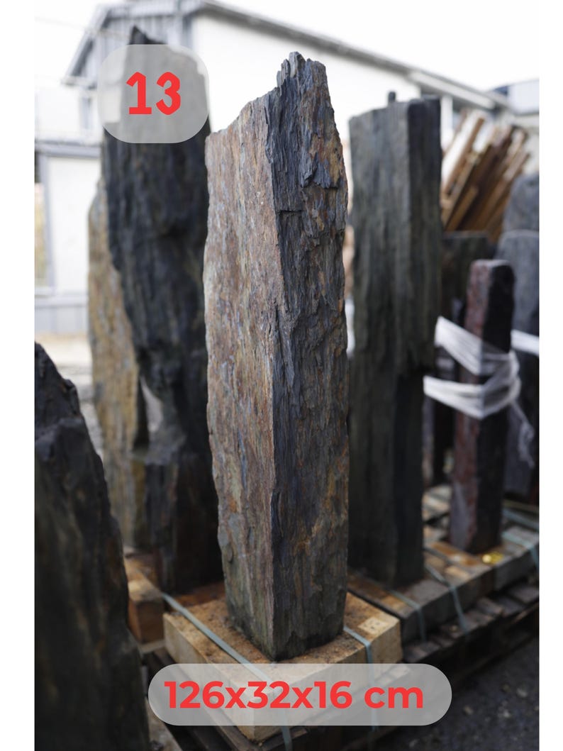 May include: A collection of rectangular, natural stone pillars. The central pillar is a mix of brown, gray, and black hues, with dimensions of 126x32x16 cm (approximately 49.6x12.6x6.3 inches). The number "13" is visible in a red circle.