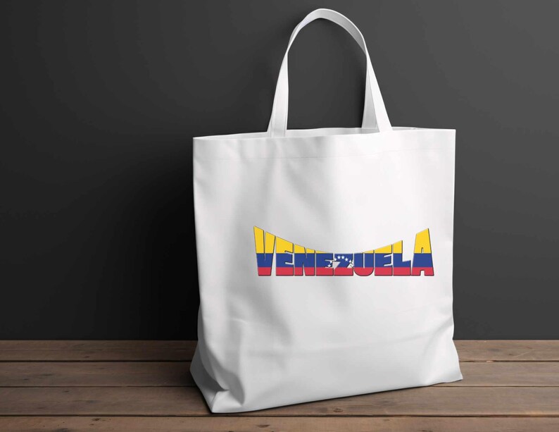 May include: White tote bag with a yellow, blue, and red graphic of the word "Venezuela" with the colors of the Venezuelan flag.