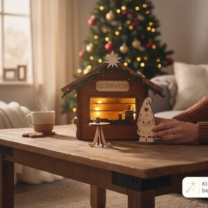 May include: A wooden miniature Gl&uuml;hwein stall featuring a peaked roof with a star topper, illuminated interior, and a small counter. A separate wooden gnome figure stands in front, accompanied by a small round table and a steaming mug.