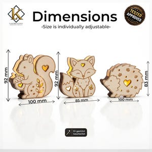 May include: Three laser-cut wooden animal figures: a squirrel holding an acorn, a fox, and a hedgehog. Each features heart-shaped cutouts and internal lighting. Dimensions are 92mm by 100mm for the squirrel, 92mm by 85mm for the fox, and 83mm by 100mm for the hedgehog.