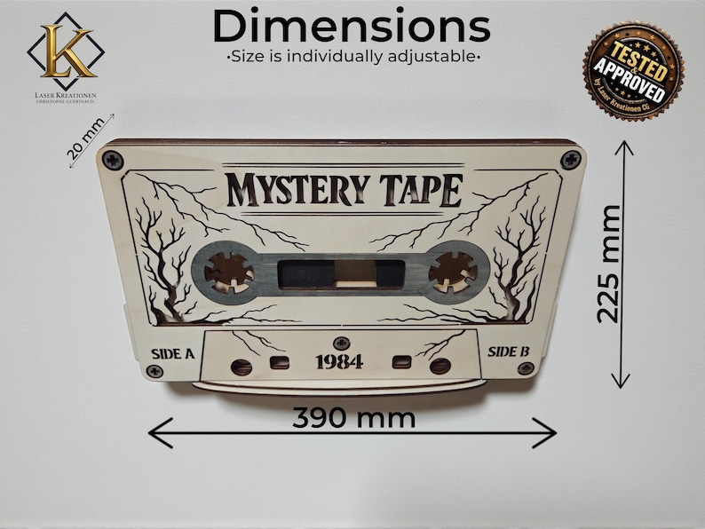 May include: A wooden cassette tape design with the text "MYSTERY TAPE" and "1984". The dimensions are approximately 15.35 inches wide and 8.86 inches high. The design includes tree branch details and is labeled "SIDE A" and "SIDE B".