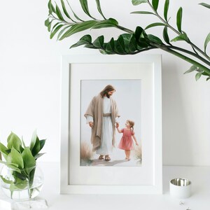 May include: A framed print of a painting depicting Jesus walking with a young girl. Jesus is wearing a light brown robe and the girl is wearing a pink dress. The painting is set against a background of green grass and a blue sky.