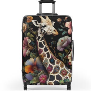 May include: A black rolling suitcase featuring a giraffe with a patterned neck and head, surrounded by colorful flowers and foliage. The giraffe is the focal point, set against a dark background. The suitcase has a retractable handle and wheels.