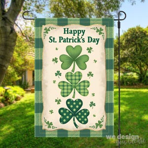 May include: A St. Patrick's Day garden flag featuring three green shamrocks with different patterns. The top shamrock is solid, the middle one is plaid, and the bottom one has polka dots. The flag has the text "Happy St. Patrick's Day" and is framed with a green plaid border.