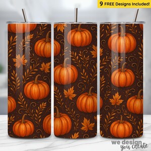 May include: A stainless steel tumbler with a fall-themed design. The tumbler features a repeating pattern of orange pumpkins, maple leaves, and foliage against a dark brown background. The text "9 FREE Designs Included!" is visible at the top.