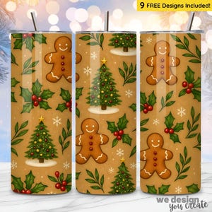 May include: A set of three stainless steel tumblers with a festive Christmas design. The tumblers feature a repeating pattern of gingerbread men, Christmas trees, holly, and snowflakes on a tan background. The text "9 FREE Designs Included!" is visible.