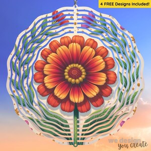 Peut inclure: Un spinner décoratif avec un motif floral. Il présente une grande fleur orange et jaune, entourée de feuilles vertes et de lignes ondulées bleues. Le texte "4 FREE Designs Included!" est visible.