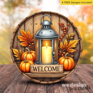 May include: A round wooden sign with a fall theme. It features a silver lantern with a lit candle, orange pumpkins, and fall leaves. The word "WELCOME" is on a wooden sign. The background is a blurred autumn scene.