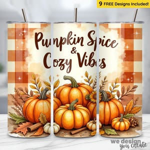 May include: A set of three stainless steel tumblers with lids and straws. The tumblers feature a fall-themed design with pumpkins, leaves, and the text "Pumpkin Spice & Cozy Vibes." The background has a plaid pattern.
