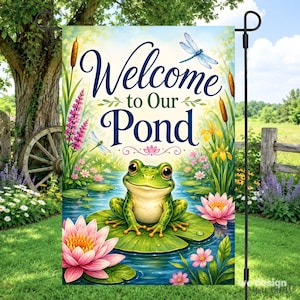 May include: A rectangular garden flag featuring a green frog sitting on a lily pad in a pond. The text "Welcome to Our Pond" is printed in dark blue script. The scene includes pink water lilies, cattails, and two dragonflies in flight.