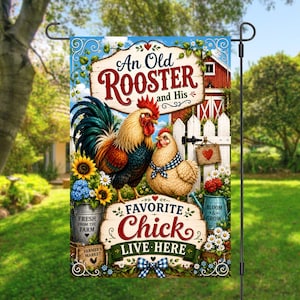 May include: A decorative garden flag featuring a colorful rooster and a hen with a blue checkered scarf. The text reads An Old Rooster and His Favorite Chick LIVE HERE. The design includes sunflowers, a red barn, and a metal bucket with text.
