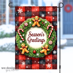May include: A Christmas garden flag with a red and black buffalo plaid background. The flag features a green wreath with gingerbread men, candy canes, and the text "Season's Greetings". Snowflakes and a red ornament complete the festive design.