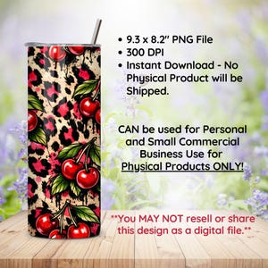 May include: A stainless steel tumbler with a cherry and leopard print design. The tumbler features a pattern of red cherries and pink leopard spots on a tan background. The tumbler also has a silver straw.