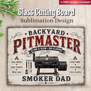 May include: A rectangular glass cutting board with a sublimation design. The design features the words "Backyard Pitmaster" in red and white, along with a smoker illustration and text that reads "Smoker Dad".