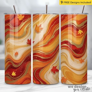 Puede incluir: Tres vasos de acero inoxidable con tapas y pajitas. Los vasos presentan un diseño abstracto en espiral en tonos naranja, rojo y dorado, con hojas de arce flotantes. El texto "9 FREE Designs Included!" es visible en la parte superior. El texto "we design you create" está en la esquina inferior derecha.