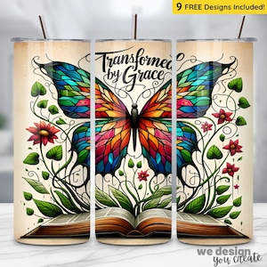 May include: A tumbler featuring a colorful butterfly design with the words "Transformed by Grace." The butterfly has wings in shades of blue, green, orange, and red. The design includes flowers, leaves, and an open book. The tumbler has a straw.