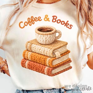 May include: Cream-colored t-shirt with the text "Coffee & Books" in orange script. The graphic features a stack of three books and a coffee cup, all with a knitted texture. The design has a cozy, autumnal theme.