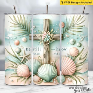 May include: A stainless steel tumbler with a beach-themed design. The design features a wooden cross adorned with flowers, seashells, and the text "Be still and know". The tumbler includes a straw and the text "9 FREE Designs Included!"