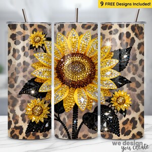 May include: A stainless steel tumbler featuring a sunflower design. The sunflower is adorned with yellow and clear rhinestones, set against a leopard print background. The tumbler includes a straw and the text "9 FREE Designs Included!"