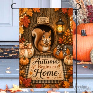 May include: A rectangular garden flag featuring a brown squirrel inside a tree hollow, a lit lantern, pumpkins with checkered bows, and autumn leaves. The text reads "HOME SWEET HOME" on a wooden sign and "Autumn Begins at Home" on a mat.