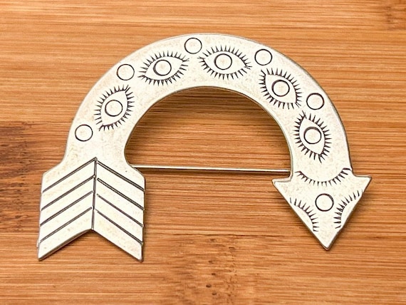 Sterling Silver Bent Arrow Brooch, Navajo Jewelry with Eye and Feather Symbolism